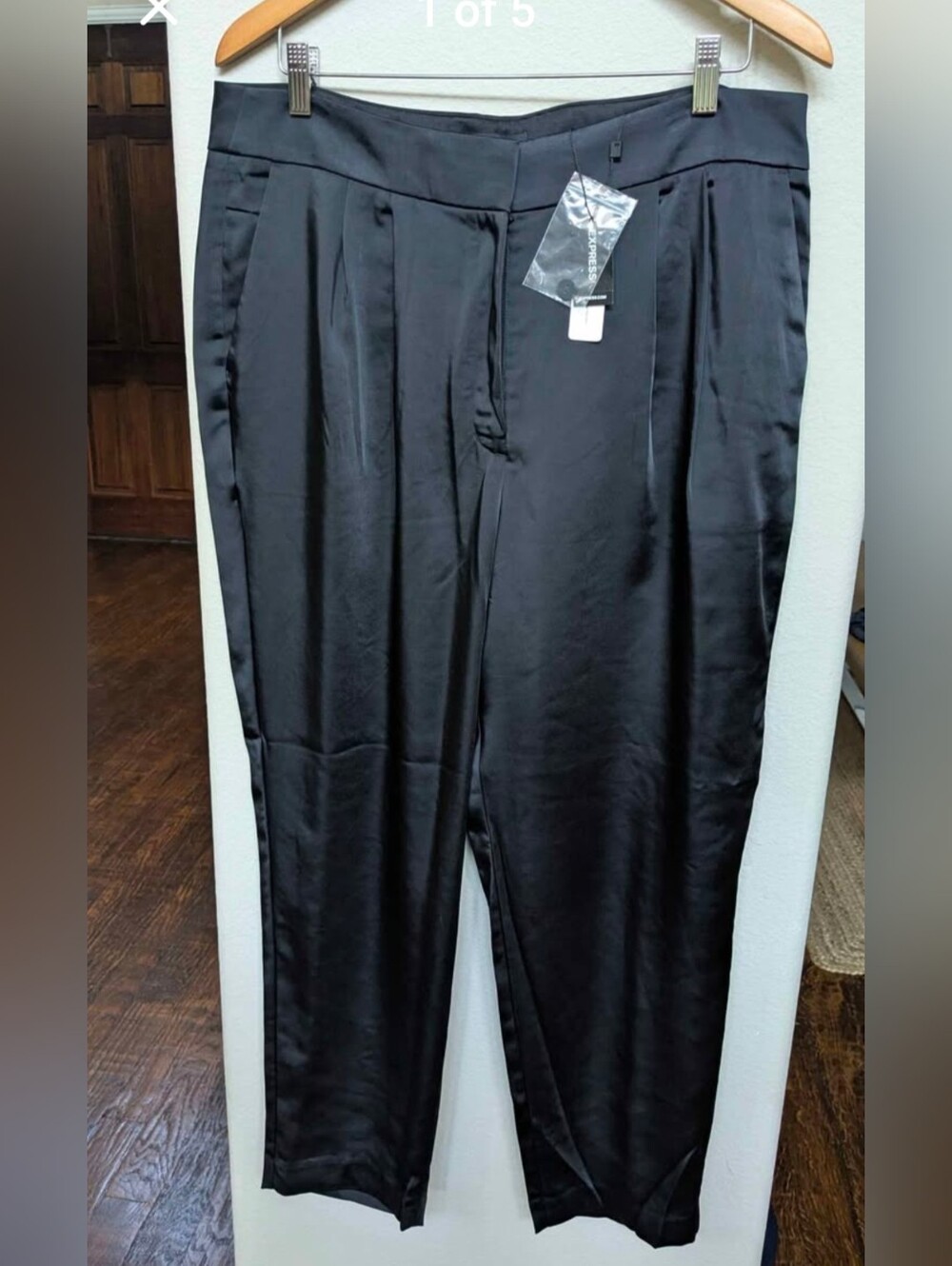 New with tags. black Express satin pants with front pleats size 14